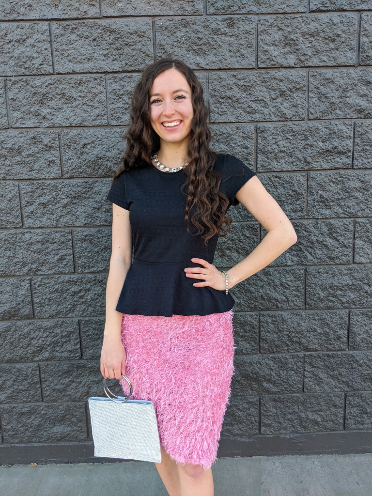 \"valentine's-day-outfit-pink-skirt-black-peplum-sparkly-necklace\"